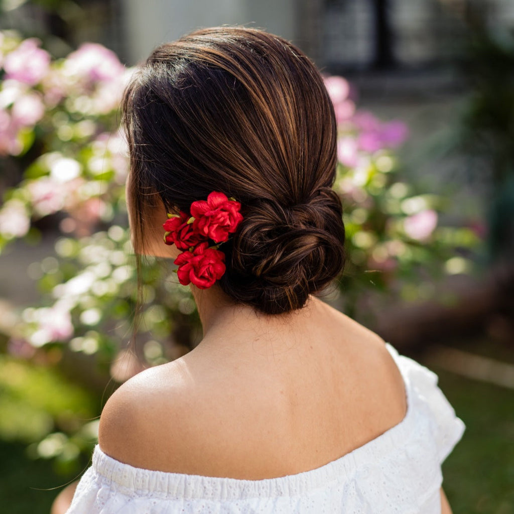 Red flower hair bun | Bun hairstyles, Flowers in hair, Hair